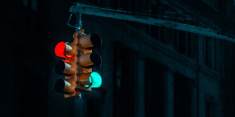 a traffic light shows a red and green light