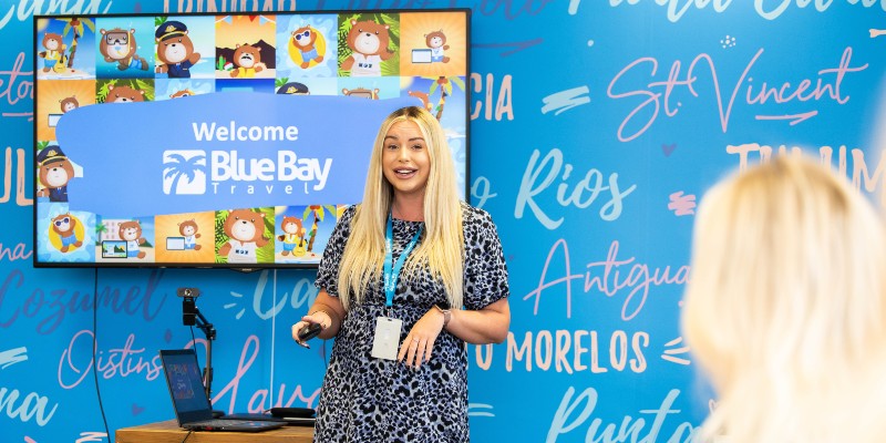 Tasha Smith at Blue Bay Travel giving a presentation